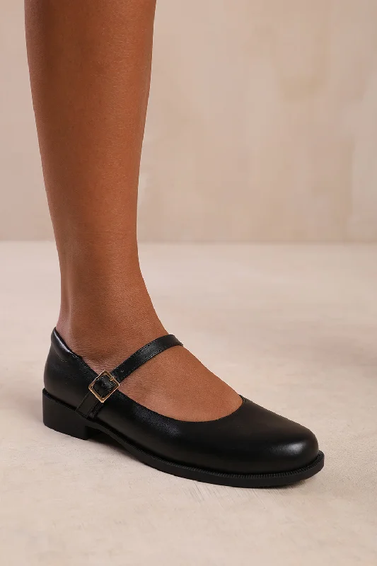 Men's loafers with a smooth leather finishKINGSTON WIDE FIT LOW HEEL LOAFER WITH STRAP AND BUCKLE DETAIL IN BLACK FAUX LEATHER Men's loafers with a smooth leather finishKINGSTON WIDE FIT LOW HEEL LOAFER WITH STRAP AND BUCKLE DETAIL IN BLACK FAUX LEATHER