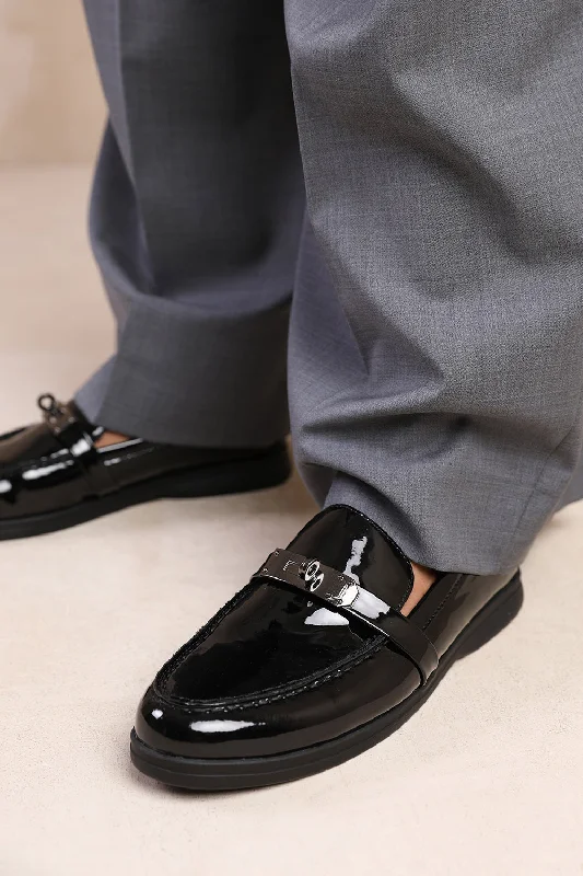 Men's loafers in a neutral color like black or brownMONACO WIDE FIT SLIP ON LOAFERS WITH METAL DETAILING IN BLACK PATENT Men's loafers in a neutral color like black or brownMONACO WIDE FIT SLIP ON LOAFERS WITH METAL DETAILING IN BLACK PATENT