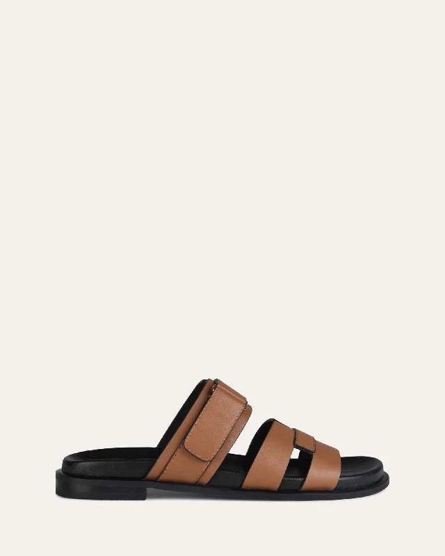 Women's Strappy Gladiator Sandals with Buckle Closures in Tan for a Boho Look Women's Strappy Gladiator Sandals with Buckle Closures in Tan for a Boho Look Women's Ankle - Strap Sandals with a Block Heel in Red for a Sophisticated StyleHENDRIX FLAT SLIDES DARK TAN LEATHER